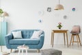 Comfy sofa, coffee table, pouf, wooden table and chair, and hang