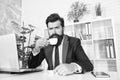 Comfy workspace. Bearded hipster formal suit relaxing with coffee. Office life is unthinkable without good coffee Royalty Free Stock Photo