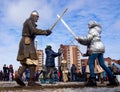 Comic `battle` with swords with the residents of the city as part of the entertainment program Shrovetide festivities