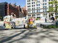 Comic book seller talking next to Flatiron building, new york