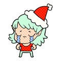 comic book style illustration of a crying elf girl wearing santa hat Royalty Free Stock Photo