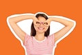 Comic crazy girl holding fingers near eyes like glasses and grimacing. emotional girl Magazine collage style with trendy color