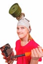 A joke,a parody.The girl in the gas mask wants to burn a soldering iron broken video card. Royalty Free Stock Photo