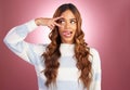 Comic face, peace sign and tongue of a woman in studio on a gradient pink background feeling silly. Young female fashion