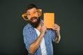 Comic and humor sense. Funny story. Study is fun. Funny book for relax. Book cover copy space. Hipster bearded man wear Royalty Free Stock Photo