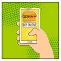 Comic phone with halftone shadows and Hamburger. Hand holding smartphone with buy online internet shopping. Fast food background.