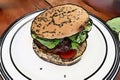 Comic style painting of a healthy burger on a white plate