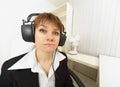 Comical girl in big stereos ear-phones Royalty Free Stock Photo