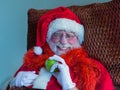 Comical Santa Claus with green apple and pillow.