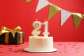 Coming of age party - 21st birthday. Delicious cake with number shaped candles on red background Royalty Free Stock Photo