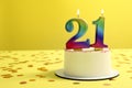 Coming of age party - 21st birthday. Delicious cake with number shaped candles on yellow background, space for text Royalty Free Stock Photo