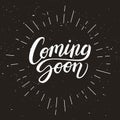 Coming soon calligraphic lettering text composition on dark background in chalkboard style, vector illustration