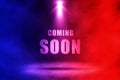 Coming soon text with red and blue spotlighting effect. Royalty Free Stock Photo