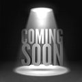 Coming soon. Text in Spotlight shine effects on a dark background Royalty Free Stock Photo