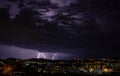 The coming storm illuminates the city. Royalty Free Stock Photo