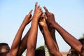 Coming together as champions. Closeup shot of a group of young boys joining their hands together in a huddle. Royalty Free Stock Photo
