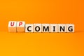 Coming or upcoming symbol. Concept words Coming and Upcoming on wooden cubes. Beautiful orange table orange background. Business Royalty Free Stock Photo
