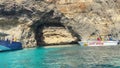 Comino, Malta, October 2023 - Visiting Popeye's Cave on a sunny day in October , boat chartering. Crystal clear