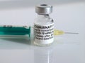 Macro of Comirnaty vaccination ampoule with a syringe against Covid-19 or Corona virus Royalty Free Stock Photo