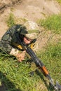 Commando ready to fire from the AK -74 at simulated enemy positions