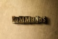 COMMANDS - close-up of grungy vintage typeset word on metal backdrop