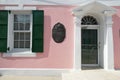 Commemorative plaque on the pink building of House of Assembly in Nassau.
