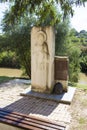 Commemorative slab and the Lom river at Rock Monastery St. Dimitar Basarabovski Royalty Free Stock Photo