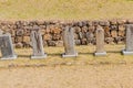 Commemorative stele in front of stone wall