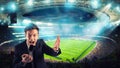 Sports journalist comments on a football match at the stadium Royalty Free Stock Photo