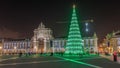 Commerce square illuminated and decorated at Christmas time in Lisbon night timelapse hyperlapse