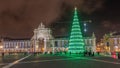 Commerce square illuminated and decorated at Christmas time in Lisbon night timelapse hyperlapse