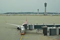 A commercial aeroplane connected to the passenger boarding bridge in Incheon International Airport, Seoul, South Korea Royalty Free Stock Photo