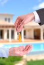 Commercial agent giving keys to customer vertical composition