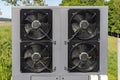 Commercial air source heat pump system installed outdoors. These systems are common in energy-efficient HVAC solutions and are Royalty Free Stock Photo