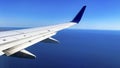 Commercial aircraft flying over the sea of cuts and approaching the international airport of Cabo San Lucas. Royalty Free Stock Photo