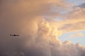 Commercial aircraft flying at sunset