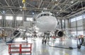 Commercial aircraft jet on maintenance of engine and fuselage check repair in airport hangar