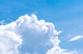 Commercial airline flying on blue sky and white fluffy clouds. Airplane flying on sunny day. Rear view of international flight Royalty Free Stock Photo
