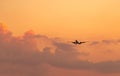 Commercial airline. Passenger plane landing at airport with beautiful sunset  sky and clouds. Arrival flight. Airplane flying Royalty Free Stock Photo