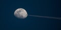 High-Altitude Airliner Passes in Front of Moon