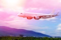 Commercial airplane above in summer season and blue sky over beautiful scenery nature background,concept business travel Royalty Free Stock Photo