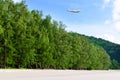 Commercial airplane above in summer season and blue sky over beautiful scenery nature background, Concept business travel and Royalty Free Stock Photo