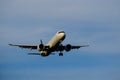 A commercial airplane approaching the airport during sunset Royalty Free Stock Photo