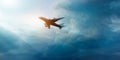 Commercial airplane in the dark sky and cloud in sunrise