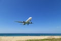 Commercial airplane landing above sea and clear blue sky over beautiful scenery nature background,concept business travel and Royalty Free Stock Photo