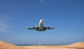 Commercial airplane landing above sea and clear blue sky over beautiful scenery nature background,concept business travel and Royalty Free Stock Photo