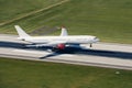 Commercial airplane landing on airport runway Royalty Free Stock Photo