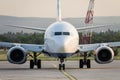 Commercial airplane standing on the airport runway. Passenger airplane landing or taking off Royalty Free Stock Photo