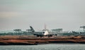 an airplane is preparing to take off from the airport with its wheels off Royalty Free Stock Photo