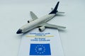 Commercial airplane toy and an EU Digital Covid-19 Certificate. Digital Green Pass. People allowed to travel concept